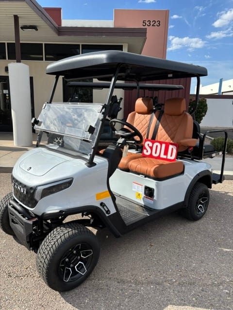 Sold sign on the converted white KANDI GOAT 2P