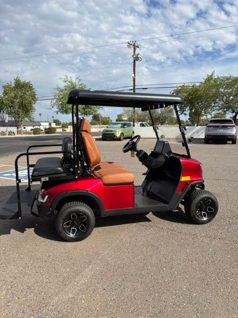 Side profile of a red 2024 KANDI GOAT 2P with rear seat kit installed