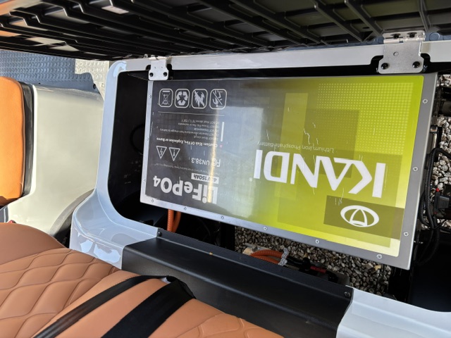 Lithium battery compartment beneath the seat of the Stone KANDI GOAT 2P