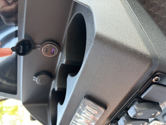Dashboard cupholders with 12V and USB charging ports on the Stone KANDI GOAT 2P