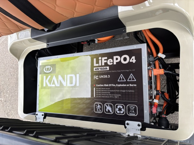 48V 150Ah LiFePO4 battery beneath the seat of the cream KANDI GOAT 2P