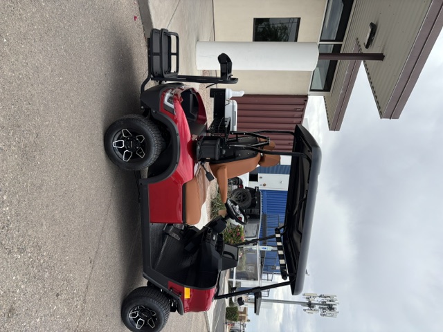 Red 2025 KANDI GOAT 2P side view with rear golf accessory package