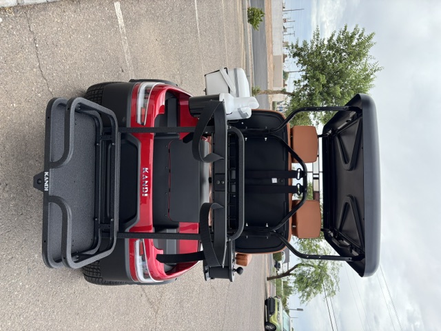 Red 2025 KANDI GOAT 2P rear view of the golf bag platform and accessories