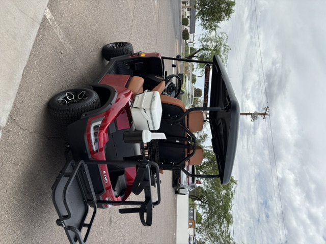 Red 2025 KANDI GOAT 2P rear three-quarter view with cooler basket and golf accessories