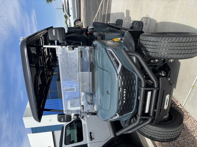 Dark green 2026 KANDI Kruiser 6Pro-B front view with brush guard and LED light bar