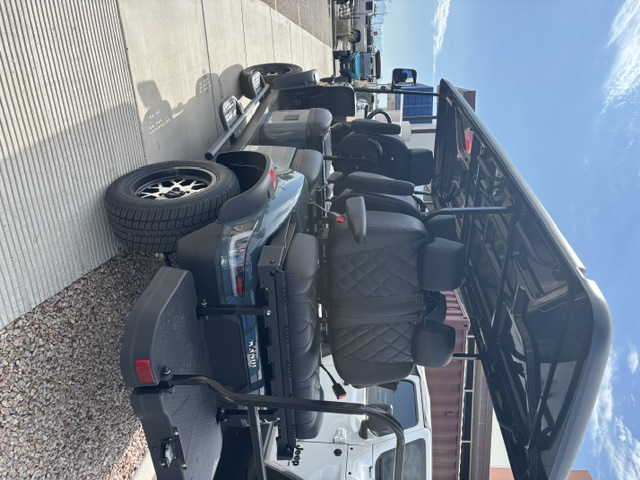 Dark green 2026 KANDI Kruiser 6Pro-B rear three-quarter view with six-passenger seating