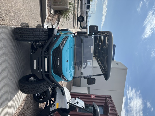 Turquoise 2026 KANDI Kruiser 6Pro-B front view with brush guard and LED light bar