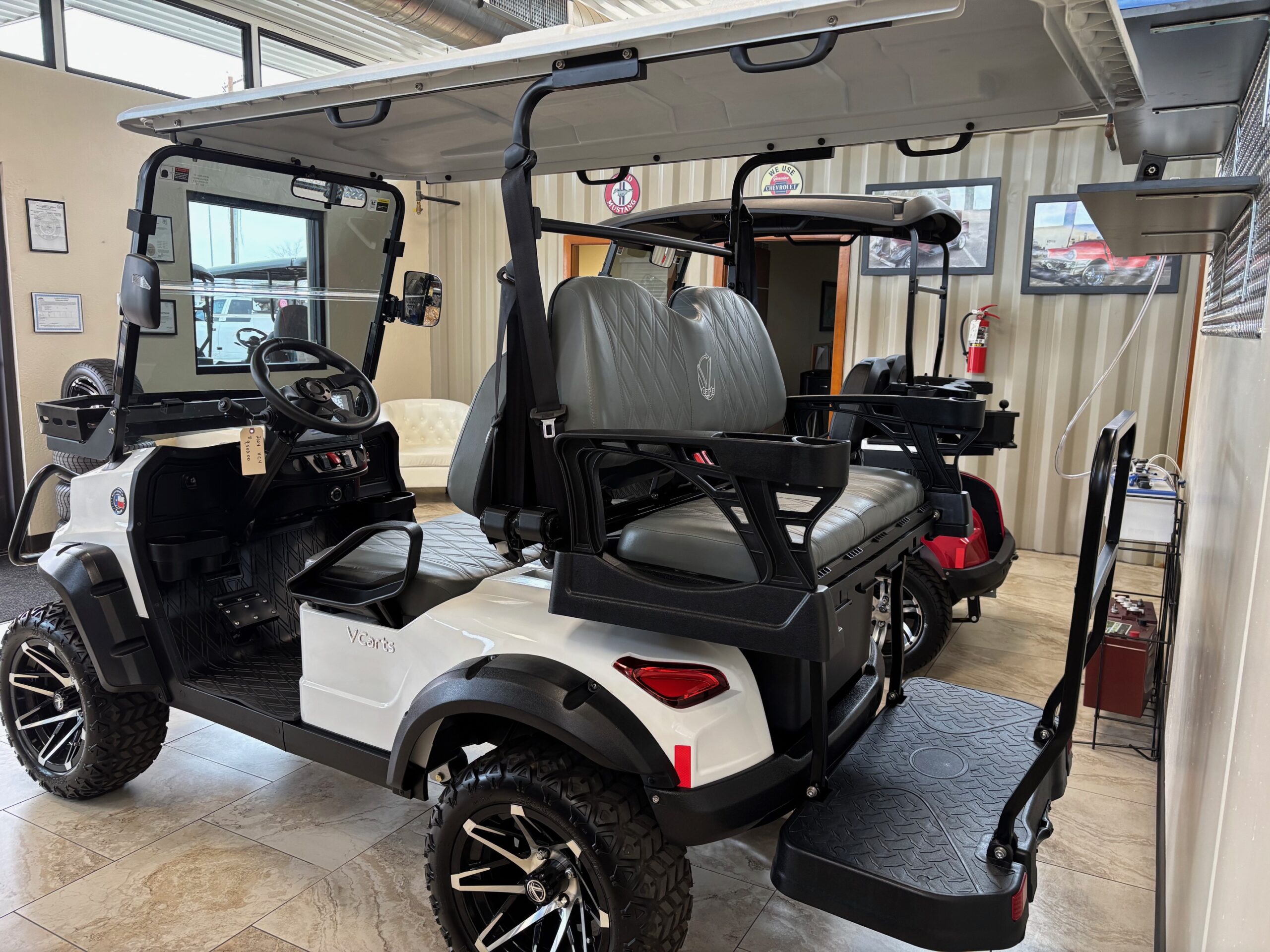 White golf cart prepared in the Mesa showroom
