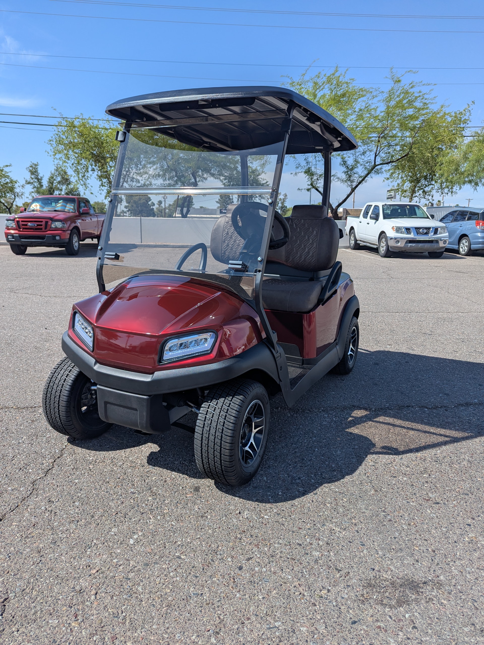 Red golf cart refresh photographed outside the Mesa shop