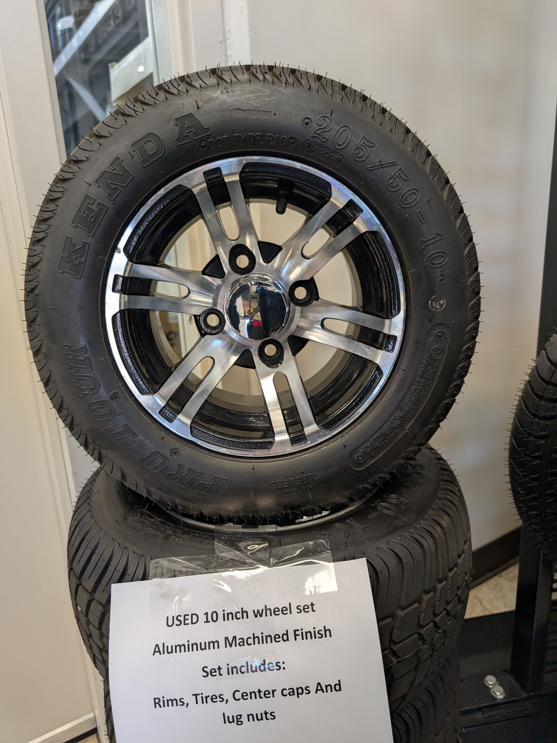 Close up of upgraded golf cart wheel and tire package